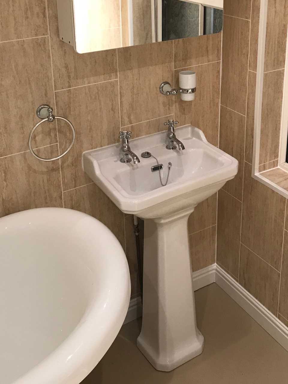 Pedestal sink unit installed in bathroom Designed for All Family